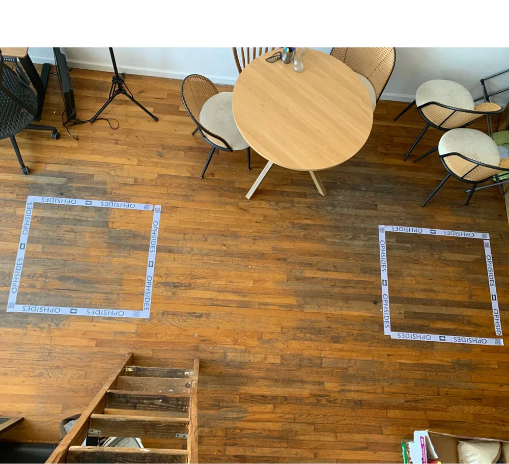 Ophsides court squares taped on a wooden floor
